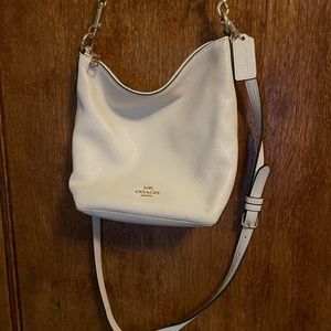 Cream color leather coach crossbody